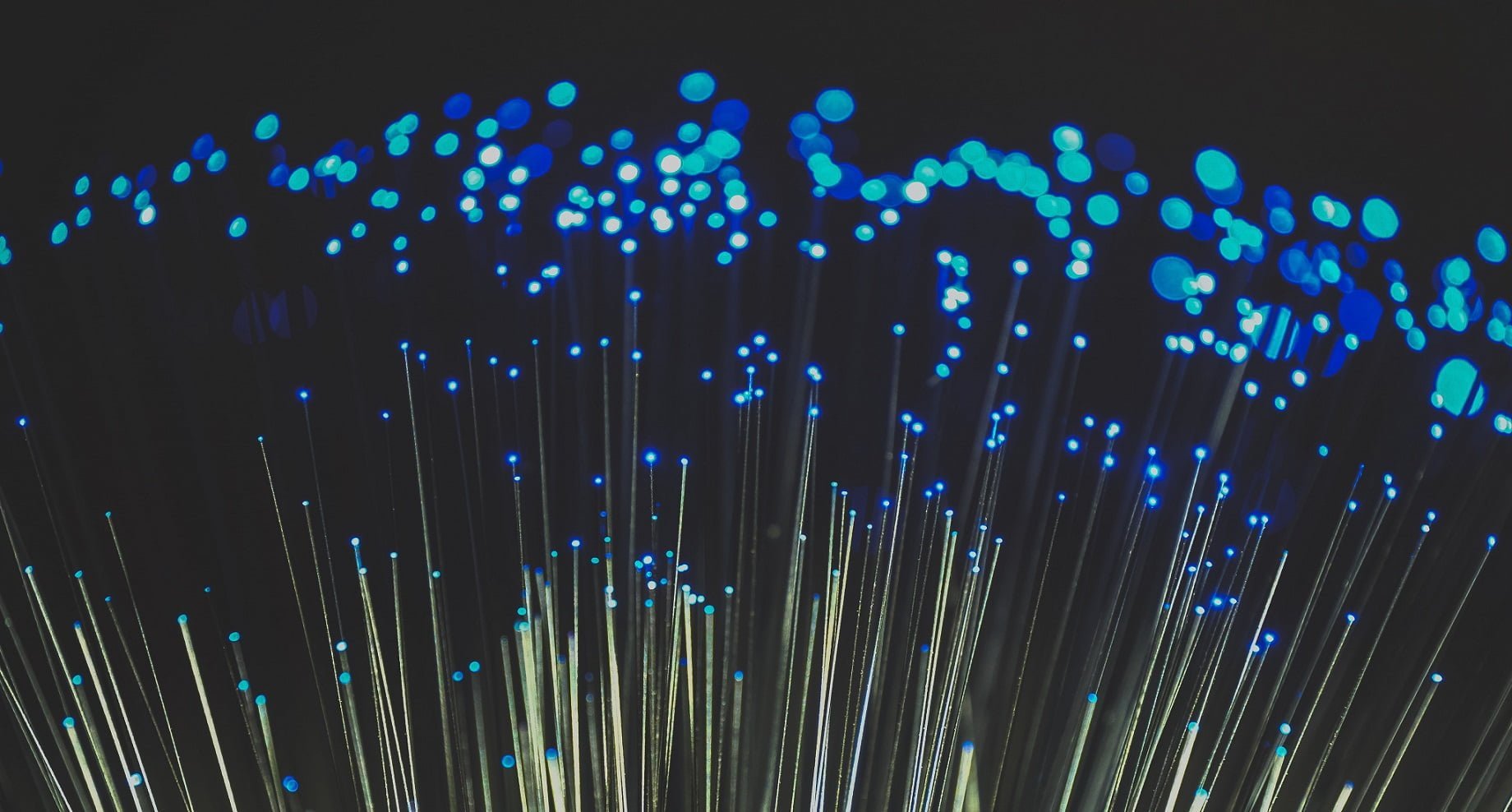 How To Get NBN Connected In Your Home 3 Fiber optic light image with blue hue on black background. Ideal image to depict broadband, technology, speed and cable infrastructure