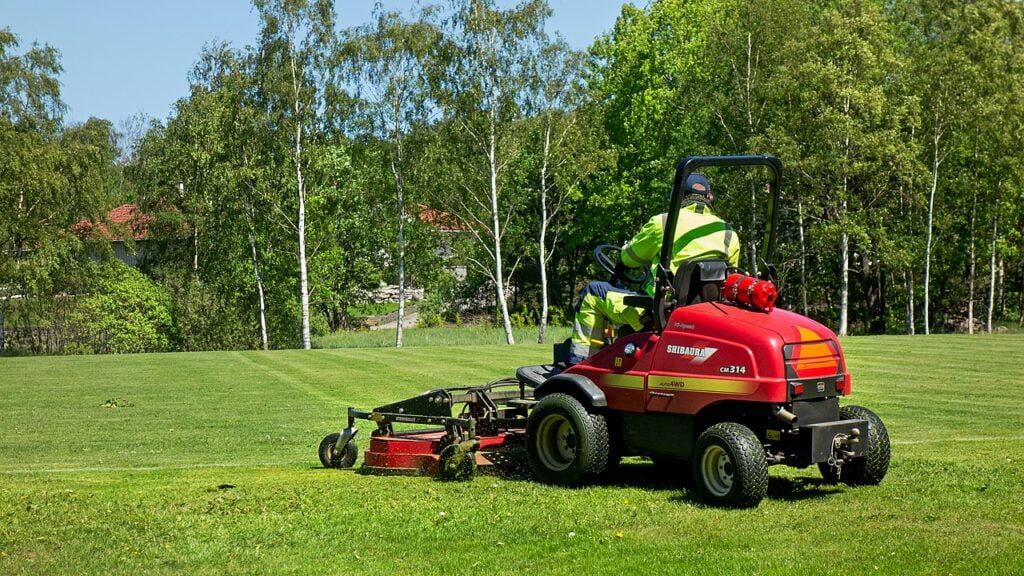 The Ultimate Guide To Grass Cutters: Types, Benefits, And Maintenance 5 Riding mower in the north soccer field in Brastad