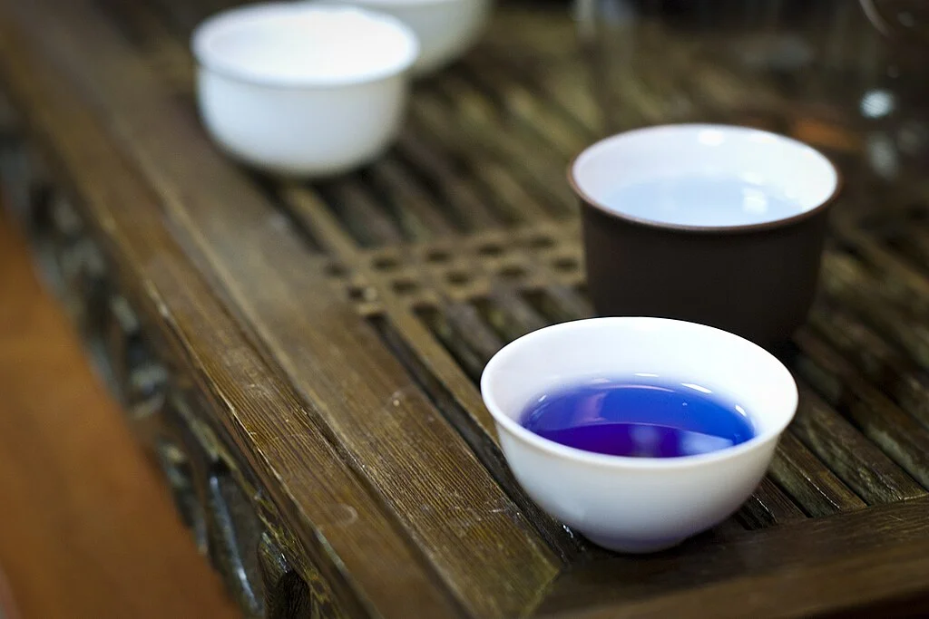 What Is A Blue Butterfly Pea Flower: Characteristics, Usage, And Cultivation 9 Tea made from Clitoria plant in a glazed white teacup.