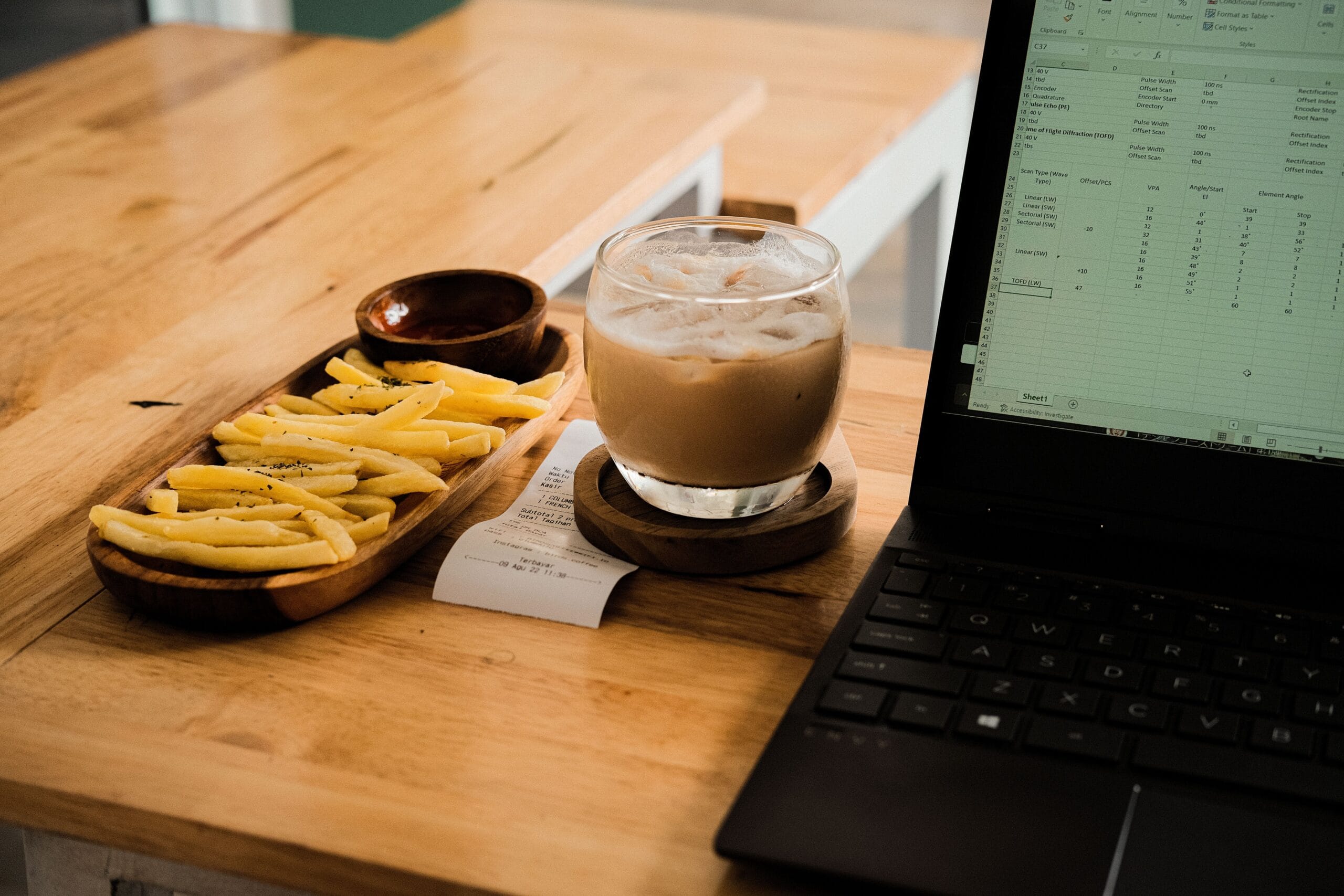 NJ Lottery Payouts: Real Money or Hype for Side Hustlers? 6 Close‑up of a budgeting spreadsheet on a tablet with a coffee mug beside it