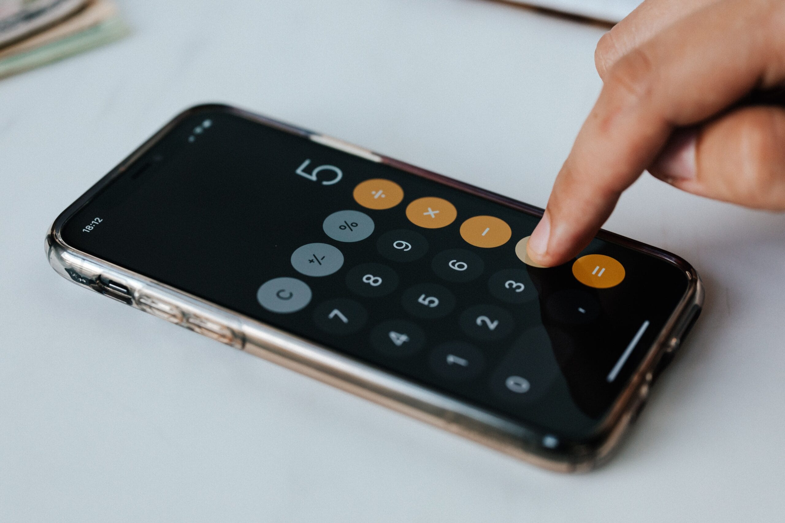 Best Beer Money Apps That Pay Cash Immediately 2 Person checking mobile earnings balance on a smartphone while resting at a modern coffee shop table