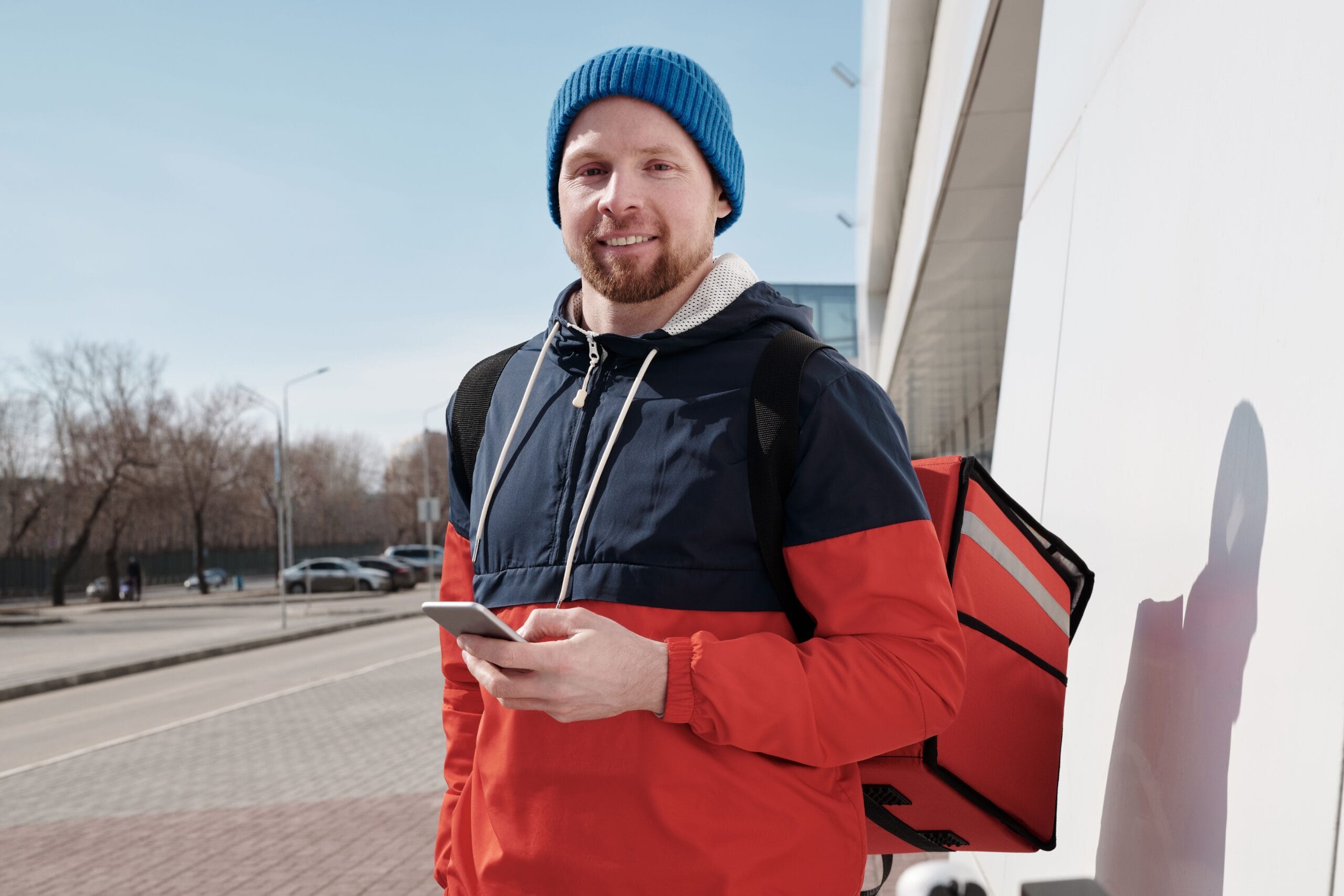 Top 8 Legit Gig Apps for Fast Weekly Payouts 2 gig worker checking phone for payout notification while sitting at a coffee shop