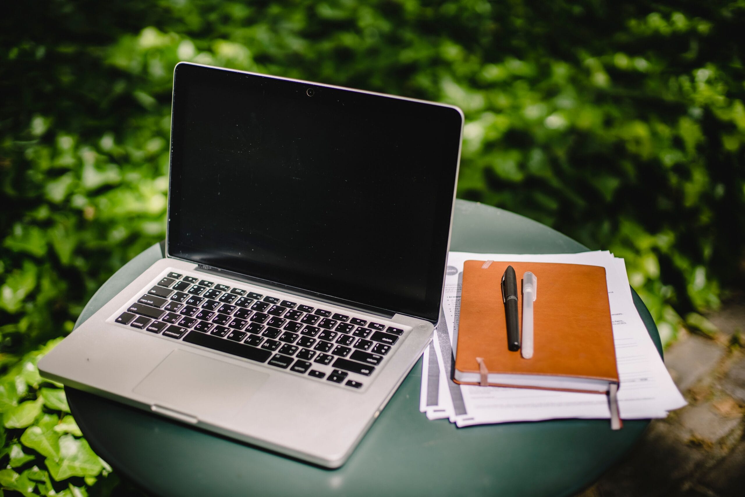 NJ Lottery Payouts: Real Money or Hype for Side Hustlers? 5 Person working on a laptop in a home office with a garden visible through the window