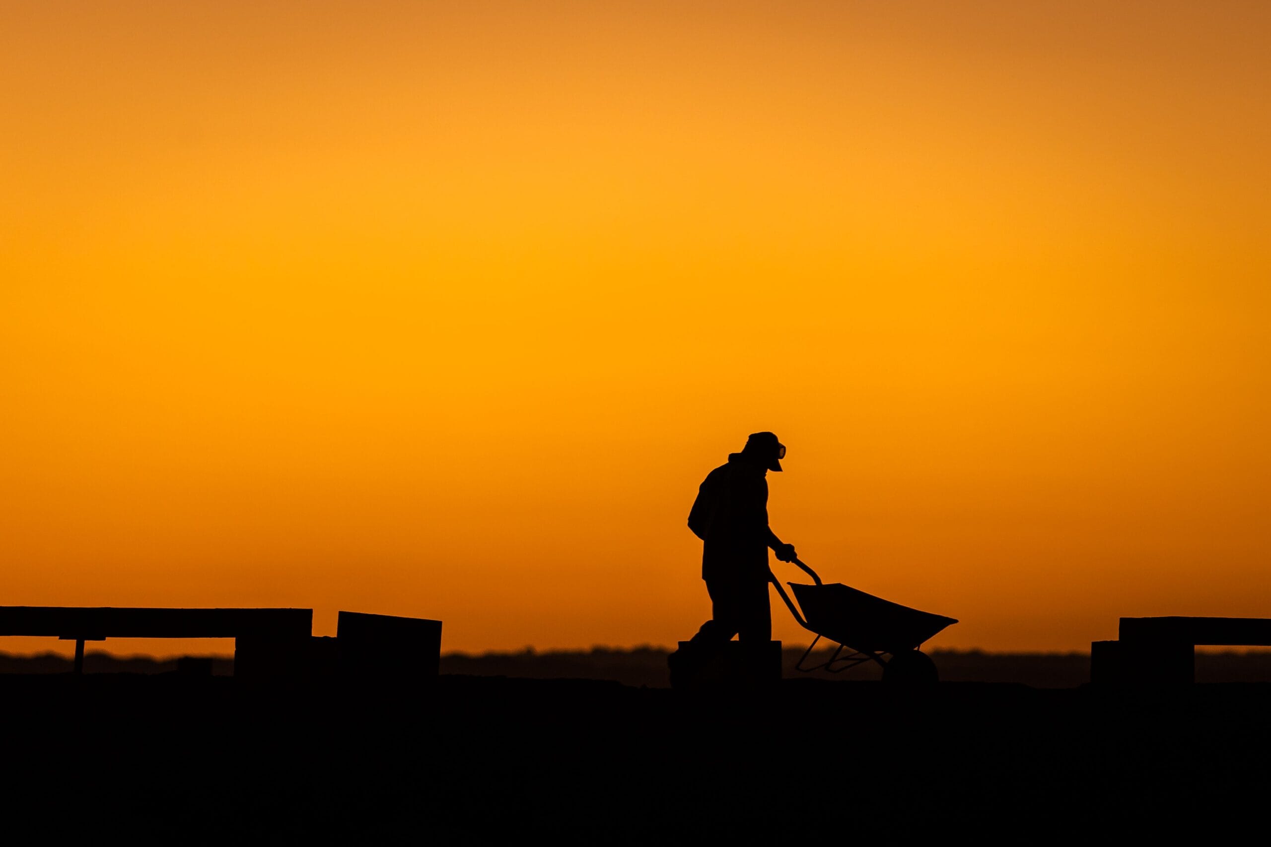How to Build Multiple Income Streams as a Gig Worker 7 A relaxed gig worker enjoying a sunset with a drink after a productive day
