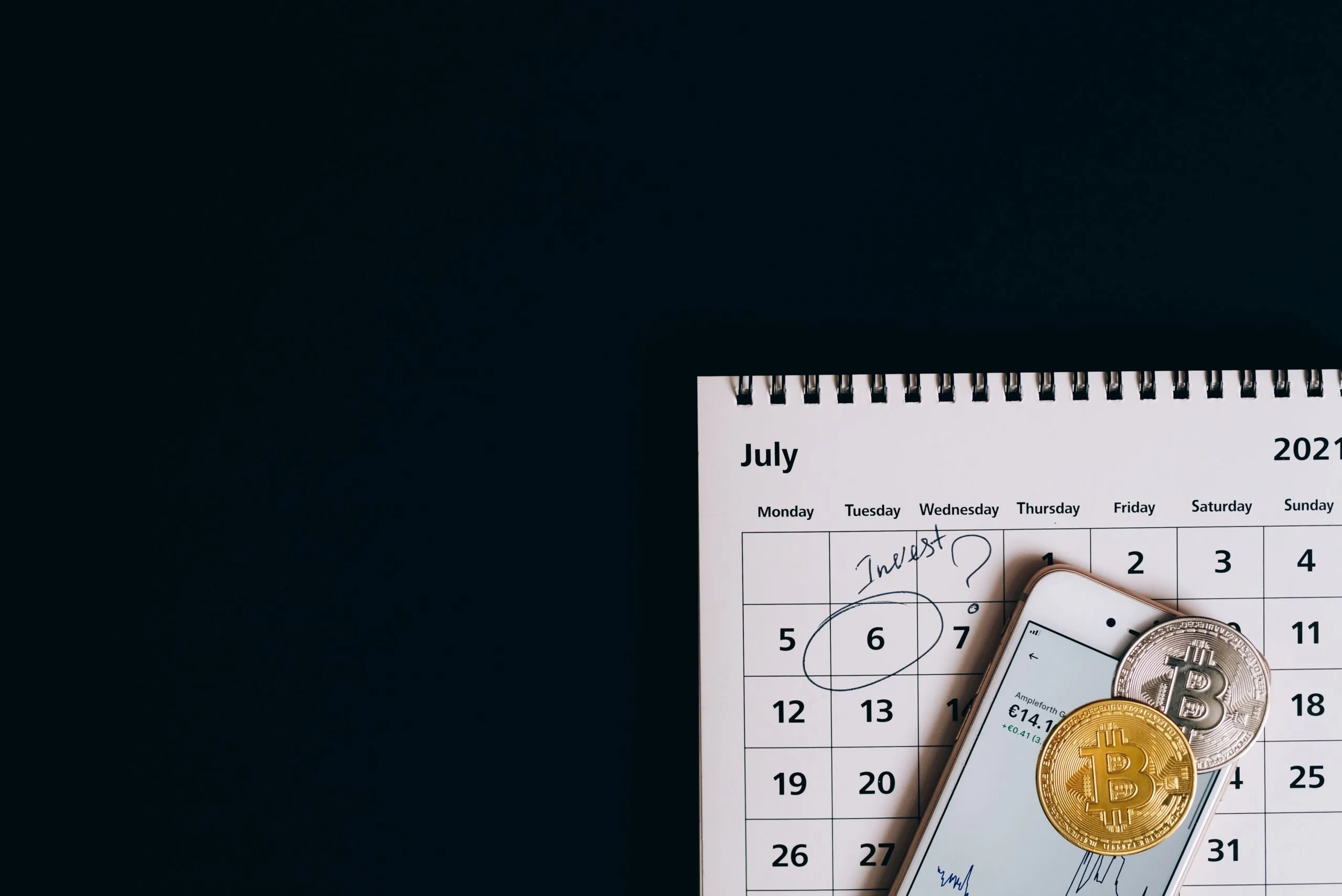Close‑up of a laptop screen showing a forex chart with a calendar overlay
