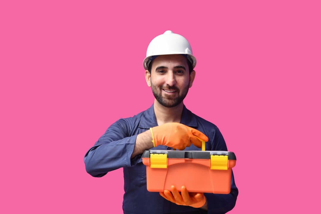 Gig Economy Side Hustles That Pay Daily or Fast in 2026 4 Handyman fixing a shelf while holding a tablet showing a task app