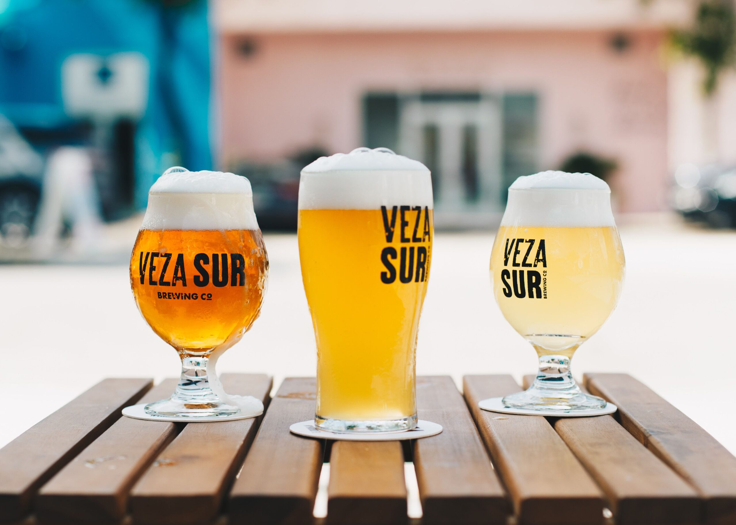 How to Earn Cash With Online Beer Tasting Panels 3 Clean glassware lined up on a wooden table next to fresh water and plain crackers