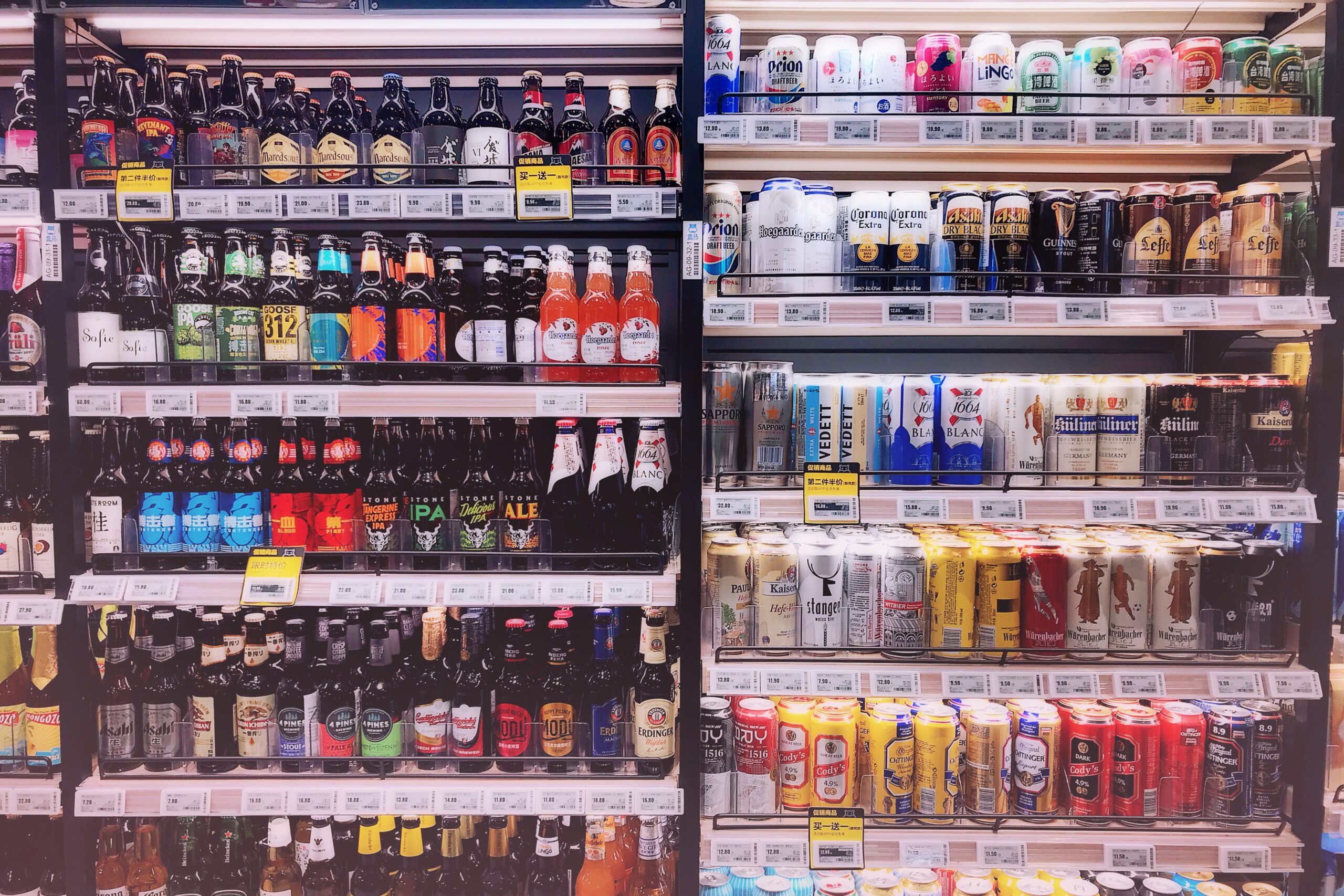 How to Make Money Selling Craft Beer Merch Online 7 display of beer‑themed mugs, stickers, and wall art in a retail setting