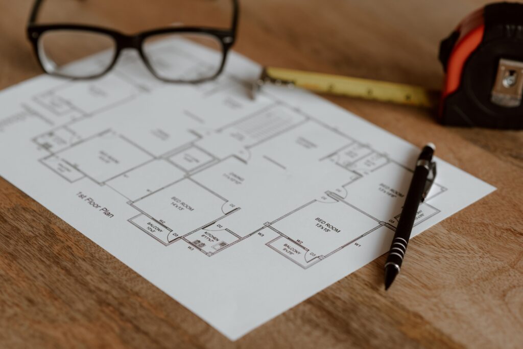 Freelancing: What It Is, How to Start, Jobs, Rates & Tips (2026) 6 A home office with a whiteboard displaying a business plan, a laptop, and a coffee mug, representing the start‑up phase of a freelance venture