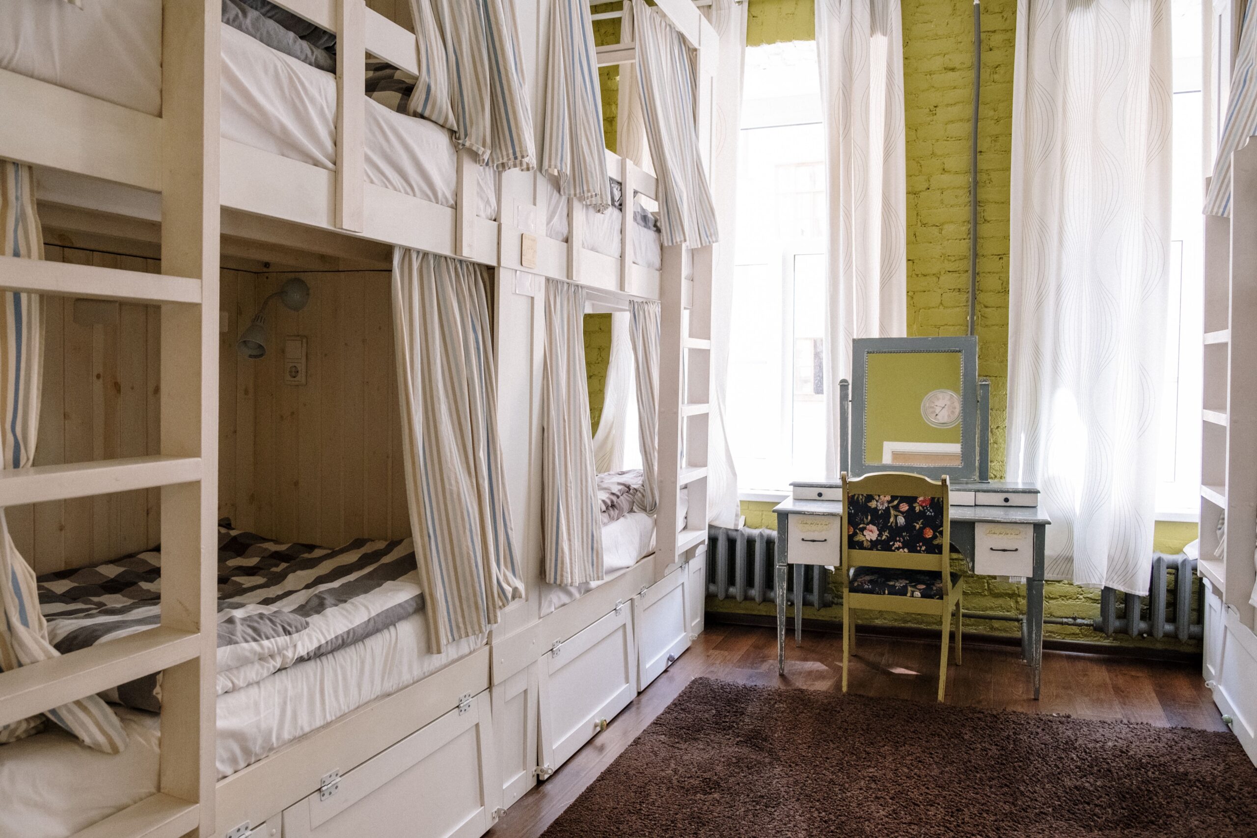 Cozy shared dormitory room in a modern budget hostel with clean bunk beds