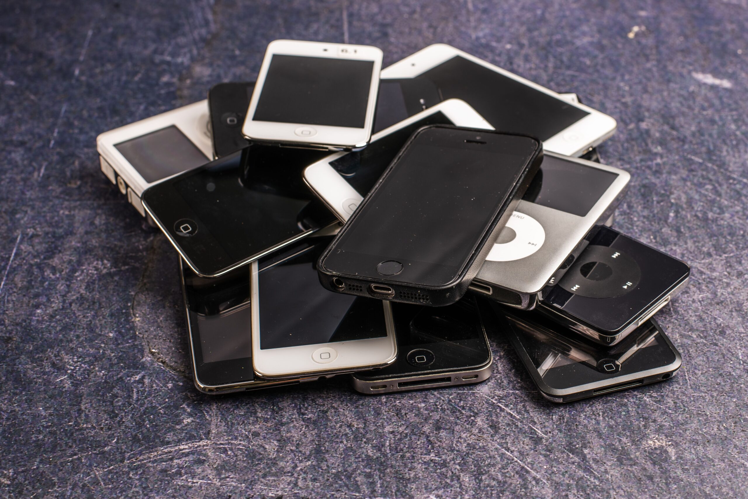 Where to Sell Old Electronics for Cash: Best Places & Tips 2 a stack of older smartphones and tablets on a table