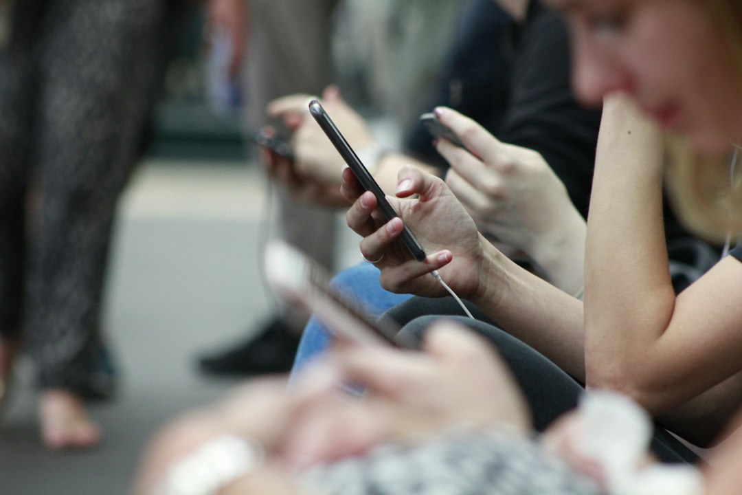 Get Paid to Test Apps: Legitimate Platforms That Actually Pay Cash 1 a person holding a smartphone while speaking into a microphone for a user testing session