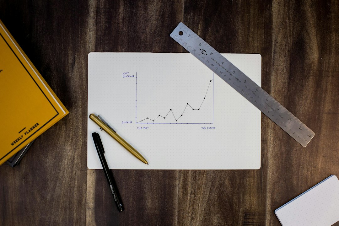Nutrition Tips: Where to Start 6 Hand holding a measuring tape around a waist while a notebook with food notes lies nearby