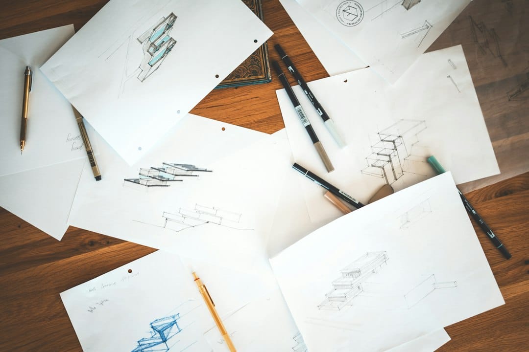 Small Business Guide: How to Start, Run, and Grow a Business 3 Close‑up of a handwritten business plan on a desk with a laptop