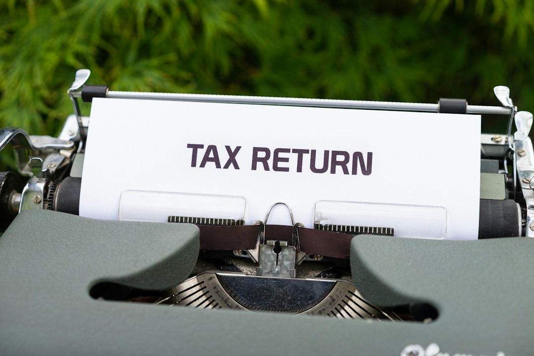 Tips Basics: A Practical Guide 5 notebook with tax forms and a coffee cup beside a laptop