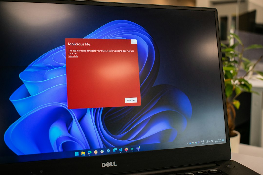 Get Paid to Test Apps: Legitimate Platforms That Actually Pay Cash 3 a warning sign on a laptop screen indicating a phishing scam in a testing portal